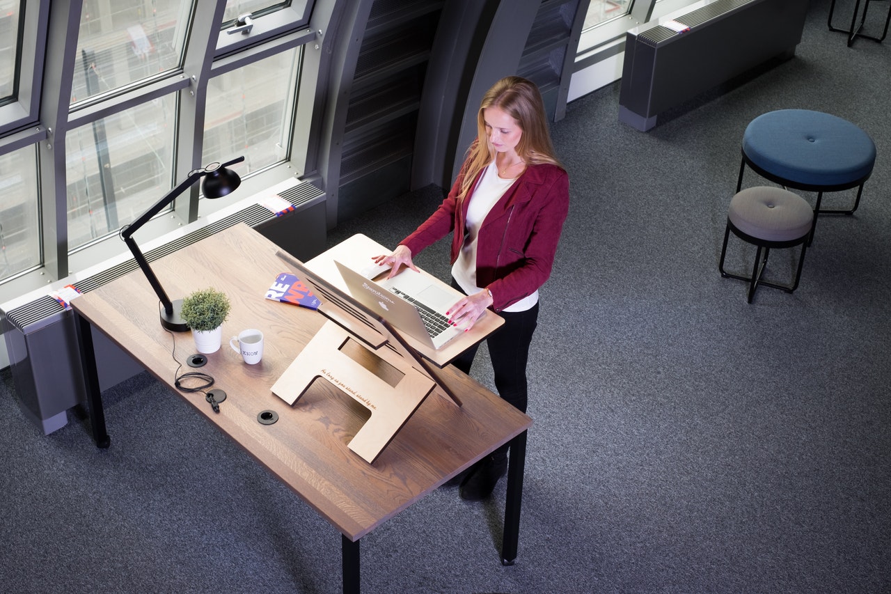 Woman at a standing desk in home office